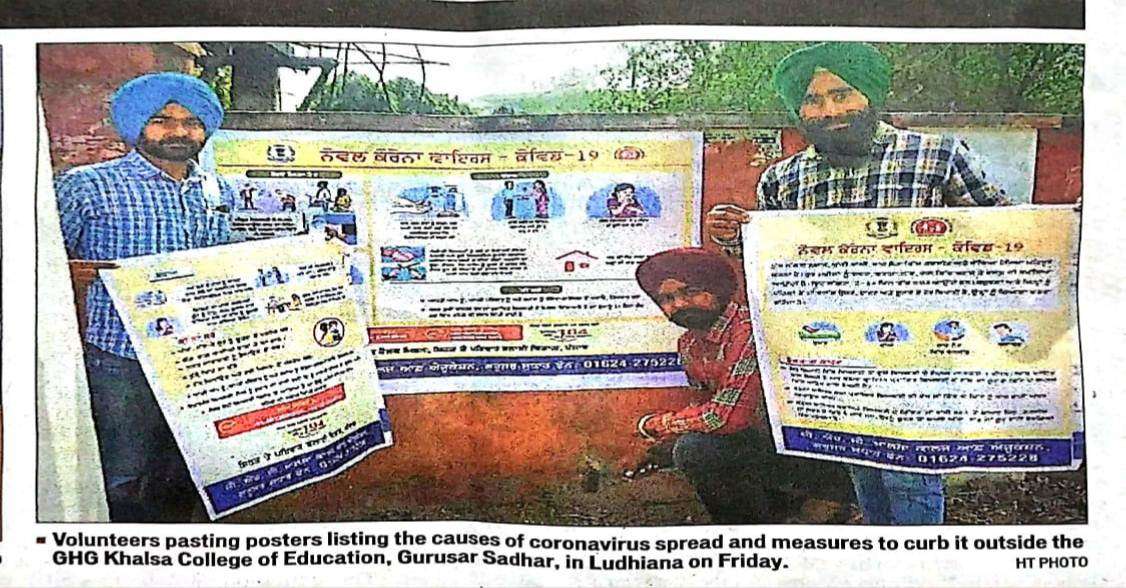 COVID-19 AWARENESS:- VOLUNTEERS PASTING POSTER 